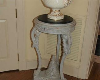 One of pair of painted stands with a painted English urn