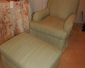 One of two upholstered bedroom chairs