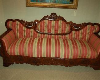 Carved settee in designed fabric