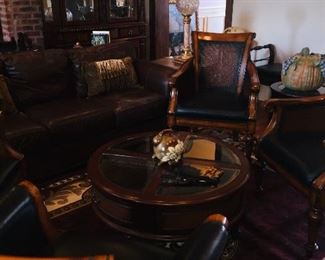 leather chairs, two leather sofas, display coffee tables, and many end tables
