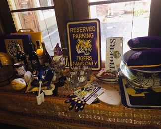 we have two tables filled with LSU shirts, hats, dishware, chairs, etch--all new
