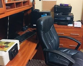 we have a completely furnished office with rolling chairs, desks, printer, and computers