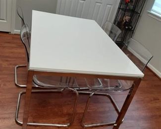 Chrome dining table with 4 lucite and chrome chairs
