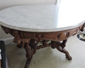 Parlor side table marble top very ornate. Fret work of parlor side table