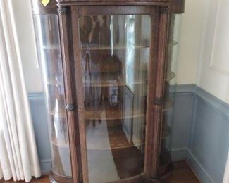 Bow front Bent Glass curio Cabinet with ornate fret work