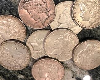 Great collection of coins and currency. Here are some pictures of some of the Morgan and Peace Dollars.