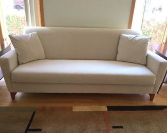 Carter Furniture 84" long one cushion couch w/wood legs and  beautifully textured off white fabric.   Remaining household items  pictures are listed below the toys so please scan all the way down.  Lot to see.