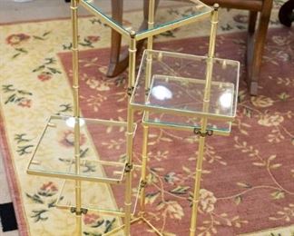 We have two gold, glass tables/displays - this one and a round one.