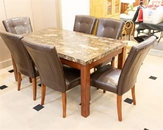 Great Table & Chairs set - perfect for a family! Vinyl chairs to wipe clean, and durable easy to care table top.