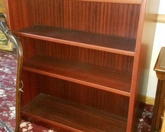Wood bookcases (two - one if front of the other)