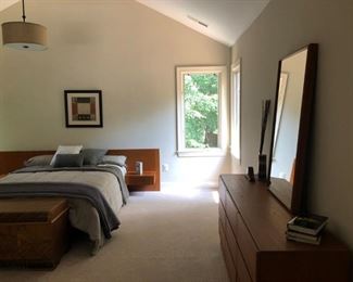 Master bedroom matching teak bedroom set with a queen bed, dresser, chest of drawers and mirror from SCAN Furniture