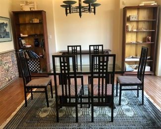 Hand-crafted ebonized walnut dining room table and 6 designer black lacquer dining room table chairs