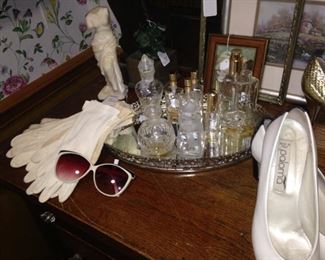 Mirrored tray; perfume bottles; kid gloves