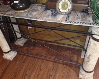 A metal and stone column table