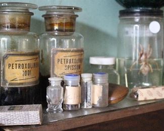 Antique jars with labels under glass