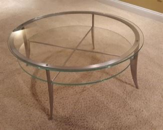 Sturdy glass coffee table on polished aluminum base, with matching sofa/entryway table.