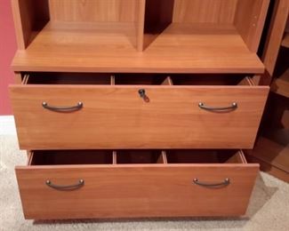 Very nice 2-piece, two drawer cabinet with cubbies. Has two matching glass door cabinets.