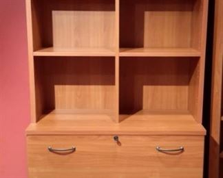 Very nice 2-piece, two drawer cabinet with cubbies. Has two matching glass door cabinets.