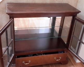 Cute little cabinet with glass doors and shelf and one drawer.