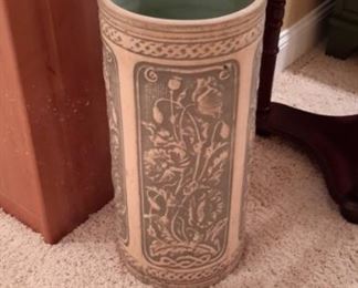 Heavy clay pot with beautiful floral design...makes a great umbrella stand.