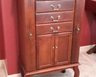 Beautiful solid wood jewelry cabinet, in great condition.