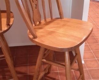 Swivel oak bar stools (two).