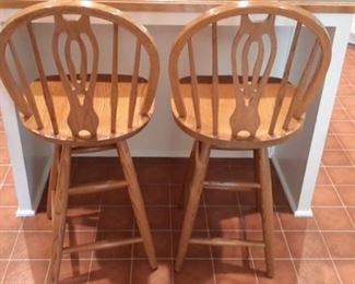 Swivel oak bar stools (two).