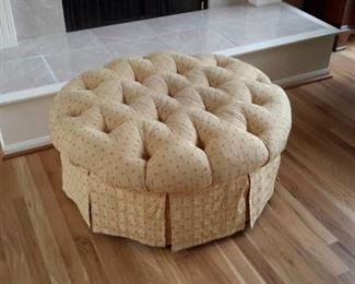 Cute tufted ottoman on casters.