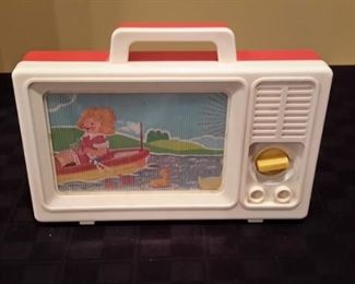 Vintage scrolling play tv with music. Works great.