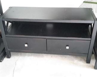 Black coffee table with drawers.