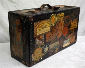 antique traveling trunk with world's stickers