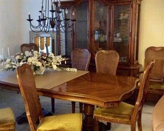 Gorgeous table with 8 cane back and velveteen cushions , table has leaf and full set of protective pads, cushions could easily be recovered