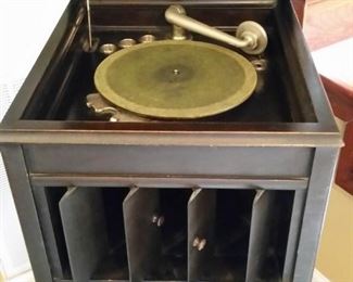 A look at the phonogaph with the top, sound chamber, and album storage open.  