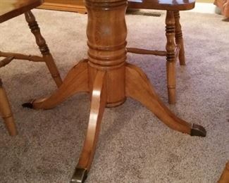 The pedestal of the oak table