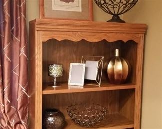 One of two oak bookshelves