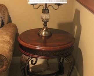 Round end tables with ornate cast iron bases (there are 2)