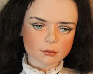 Close up of doll face. Hand painted, realistic looking.