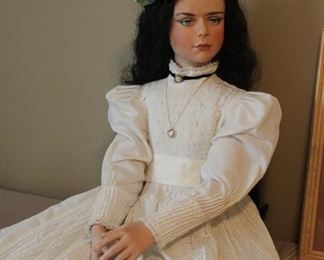 Doll has posable limbs, torso and head.