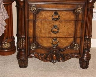 Nightstand with beautiful carving and hardware.