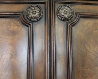 detail of wood and gilded carving on wardrobe armoire (part of set)