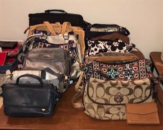 Several purses including Coach, Fossil, and Vera Bradley