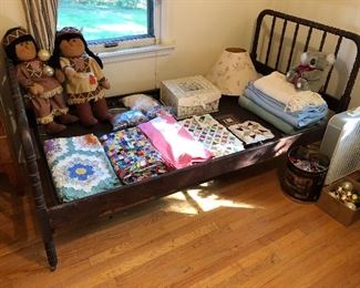 Vintage single bed w/wood frame.