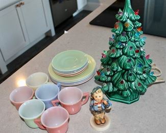Hazel Atlas cups and saucers; ceramic Christmas tree;  Goebel Hummel figurine.