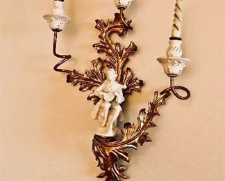 AN ITALIAN ANTIQUE WALL HANGING: A PORCELAIN MAN PLAYS THE BANJO SURROUNDED BY GOLD LEAF: A porcelain man plays the banjo surrounded by gold leaf and 3 porcelain candles. Height 36 x Width 17 x Depth 5.5 inches