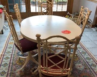 vintage kitchen table with 6 wrouth iron faux bamboo chairs; wrought iron legs; one leaf