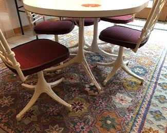vintage kitchen table with 6 wrouth iron faux bamboo chairs; wrought iron legs; one leaf