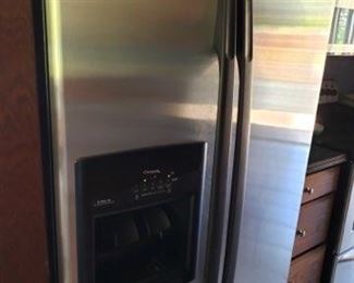 Whirlpool side by side refrigerator with water