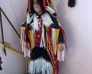 Porcelain Native American Indian doll with stand