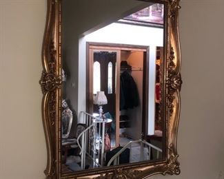 Gold framed wall mirror