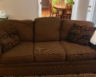 three cushion brown fabric sofa